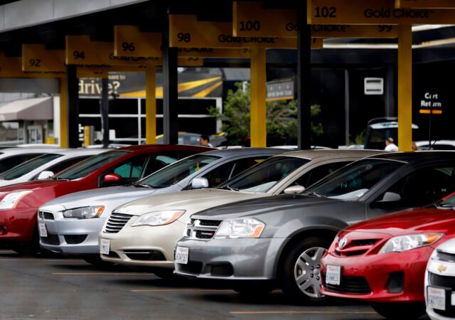 Hertz Global Holdings Inc. rental cars sit parked at the company's location at Los Angeles International Airport (LAX) in Los Angeles, California, U.S., on Friday, July 26, 2013. Hertz Global Holdings Inc. is scheduled to release earnings figures on July 29. Photographer: Patrick T. Fallon/Bloomberg via Getty Images